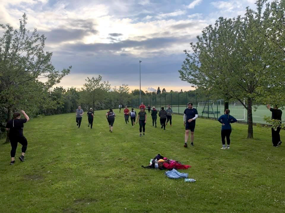 A group of people in a park  Description automatically generated with medium confidence